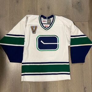 Vancouver Canucks Jersey - stick and rink signed by Kelly Hrudey